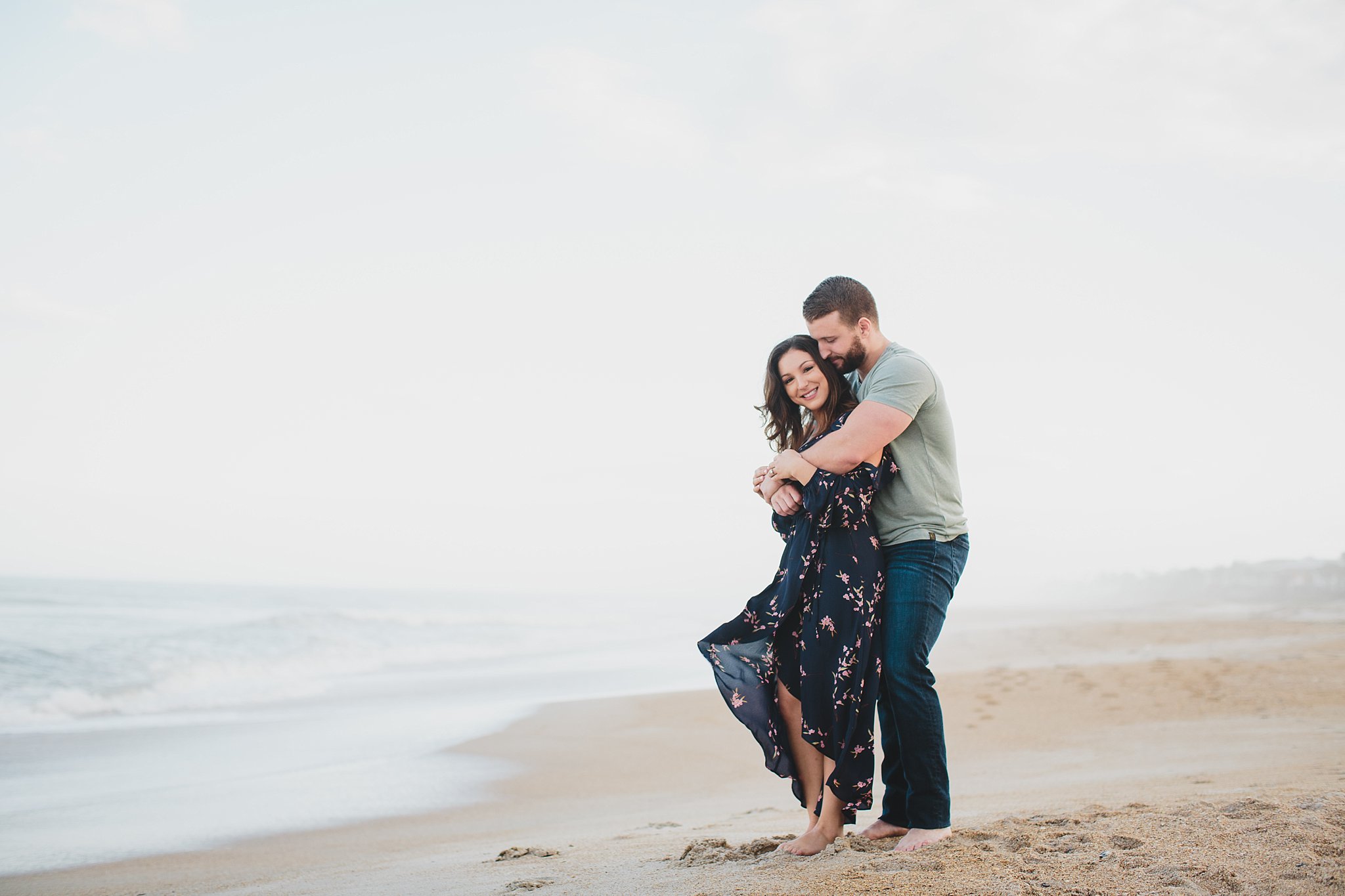 couple hugging and standing on ponte vedra beach