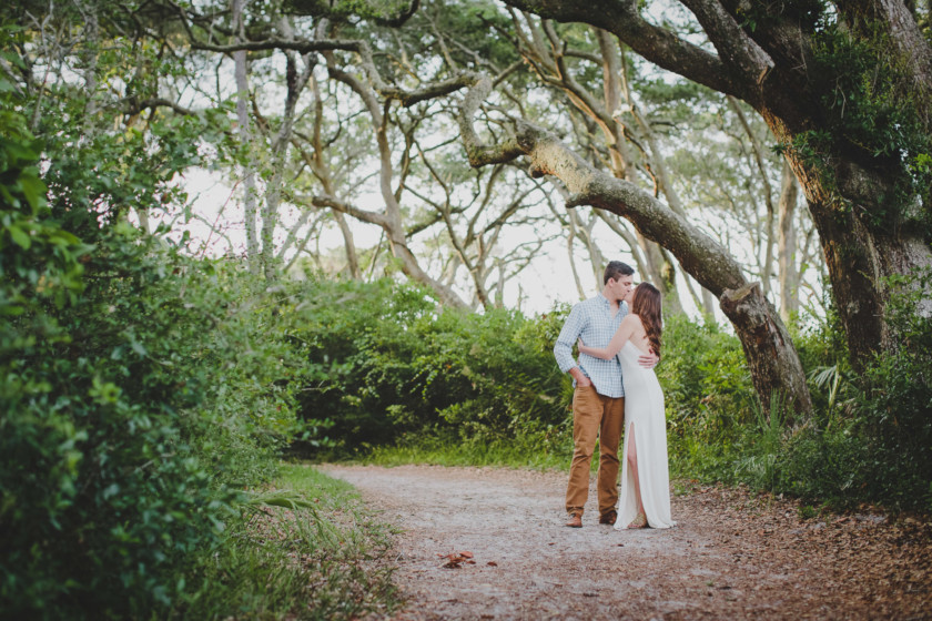 couple kissing during their engagement session at big talbot island