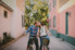 couple sitting on bikes and leaning in to kiss
