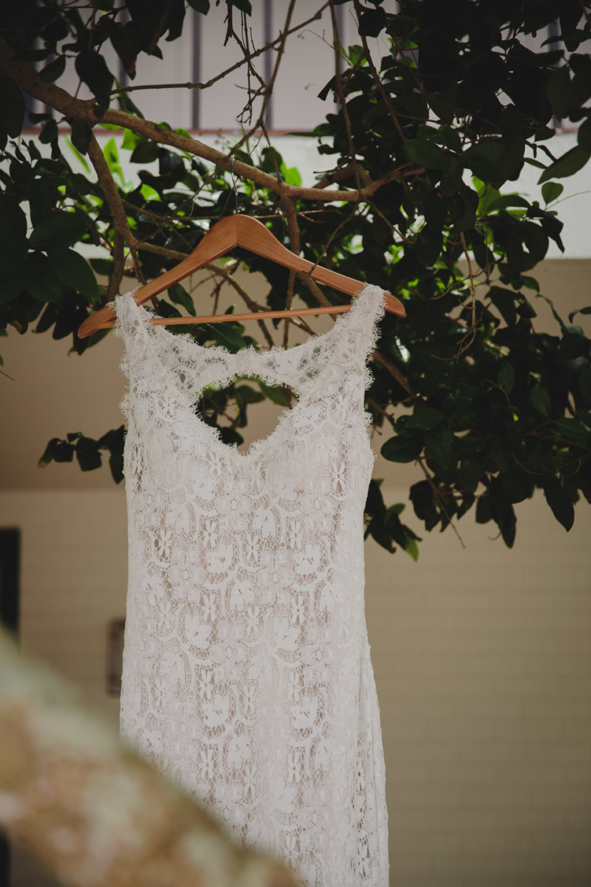 bride's gown hanging from tree