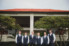 groom and groomsmen standing together in front of ponte vedra inn
