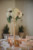 tall gold stand with florals on top for centerpiece