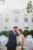 bride and groom kissing in courtyard of jacksonville beach hotel