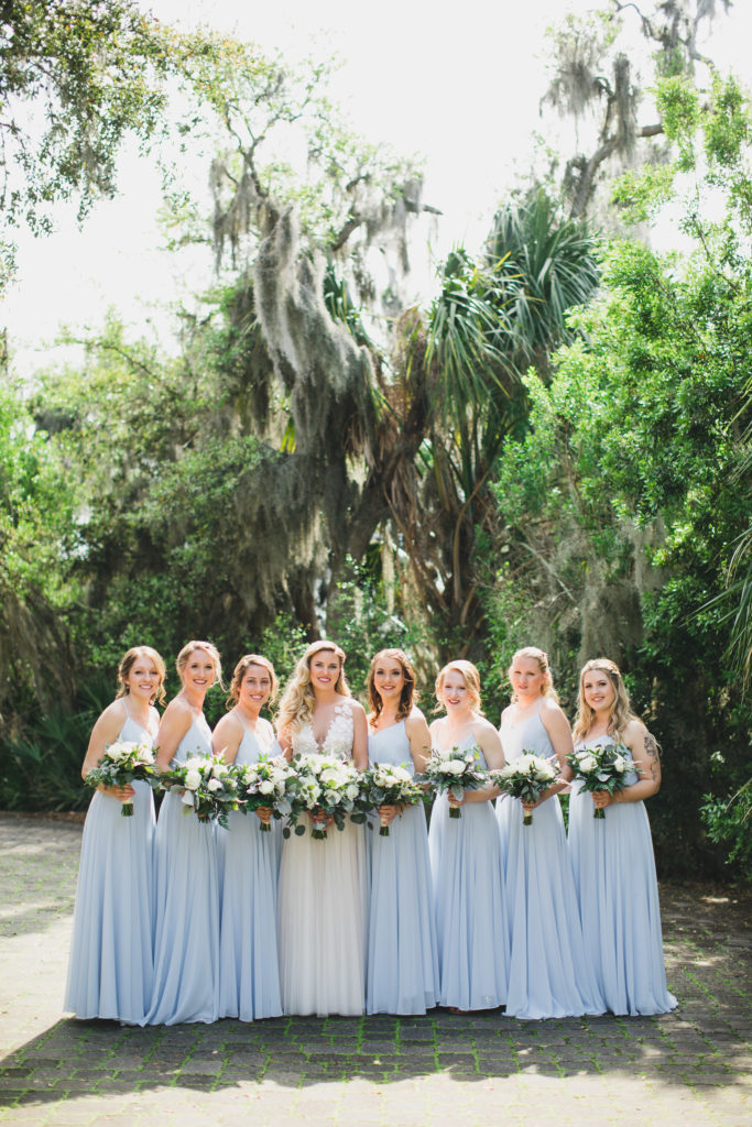 bride and bridesmaids standing together