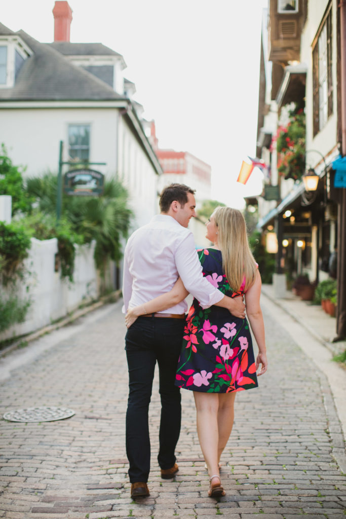 engaged couple walking down st. augustine streets