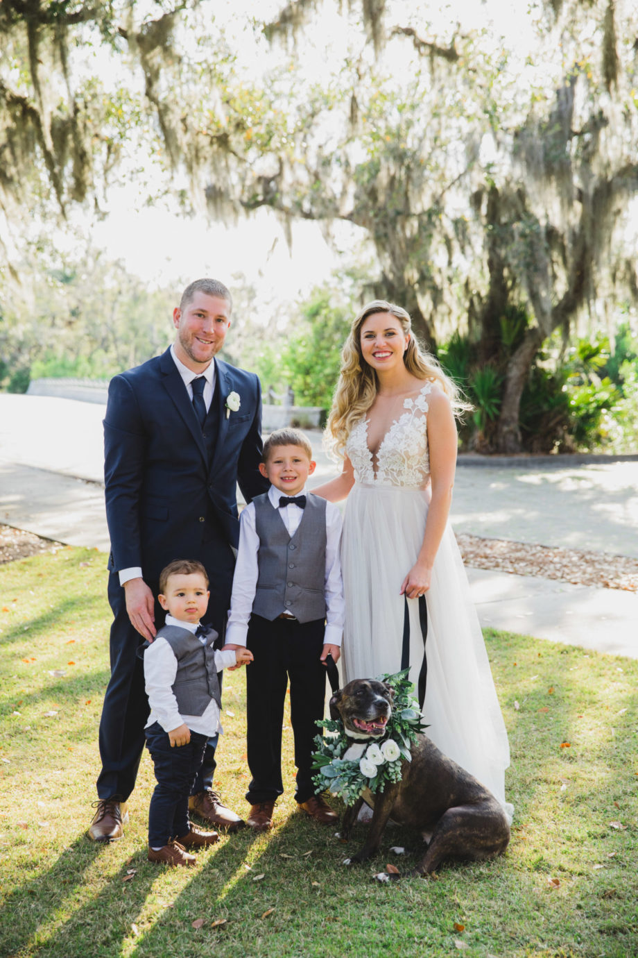 bride and groom with ring bearers and dog flower girl at oyster bay yacht club wedding