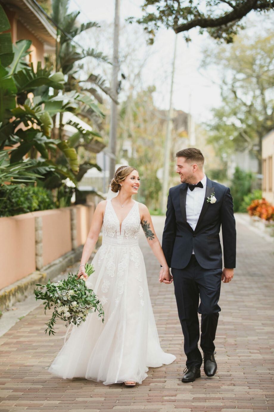 bride and groom walking down charlotte street