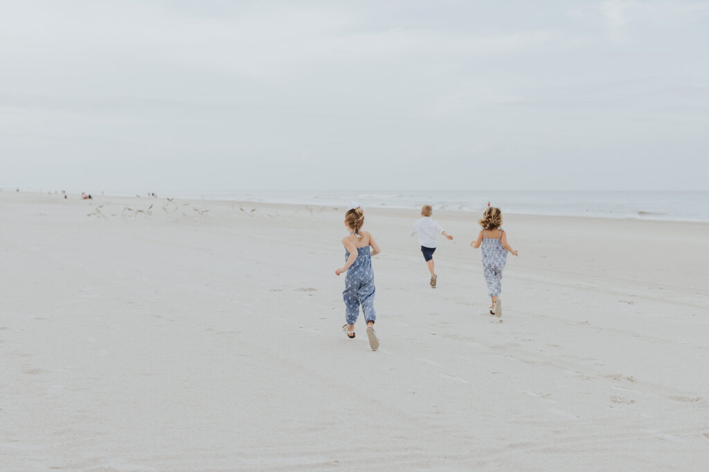 kids running on ponte vedra beach during family session 