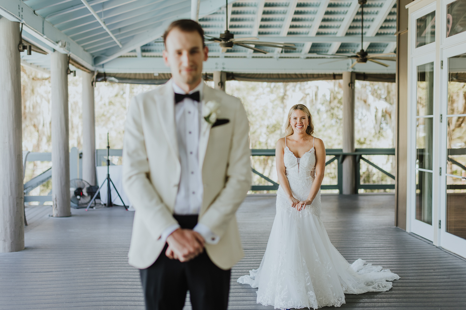 bride walking up to groom for first look before their wedding at oyster bay yacht club 