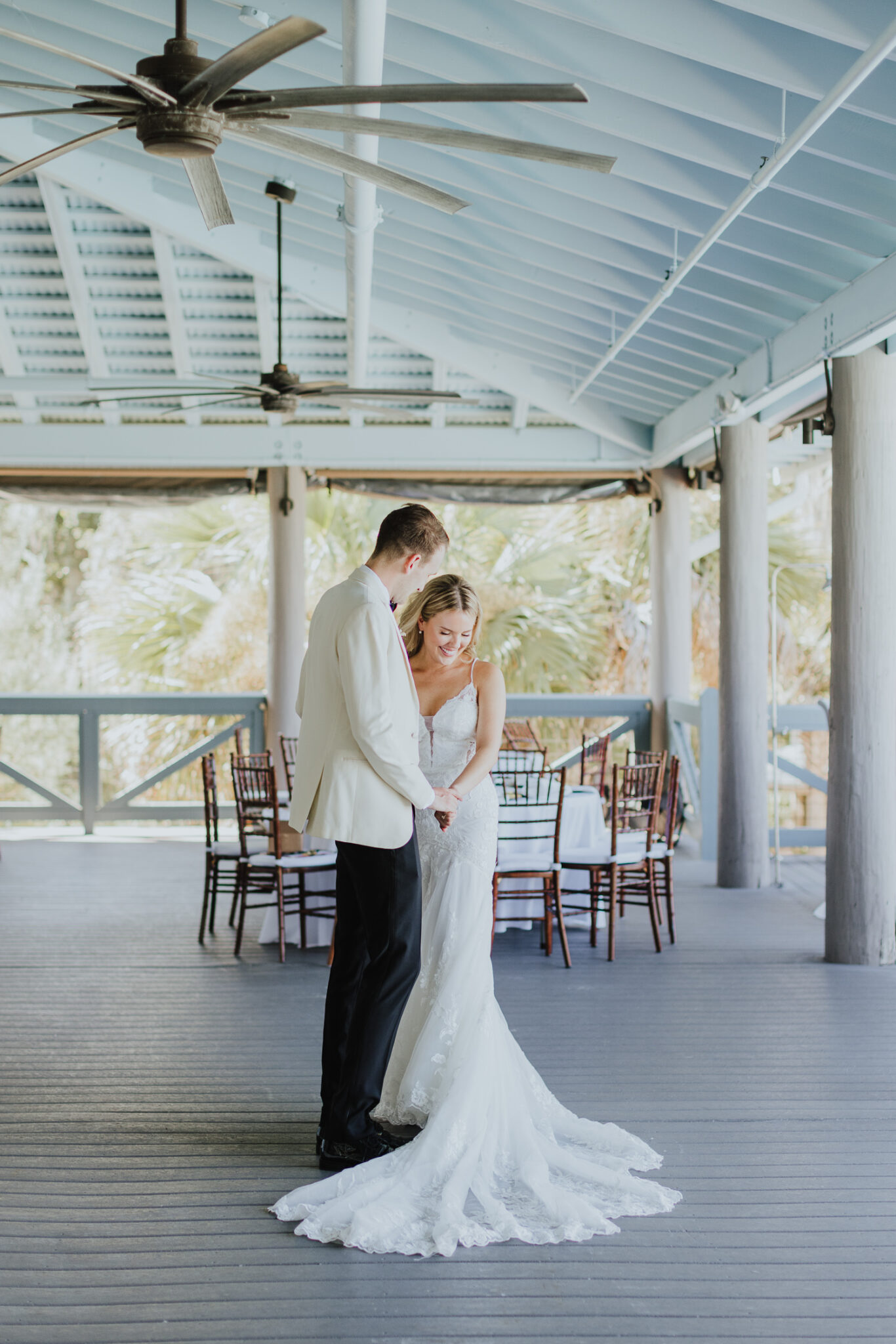 groom looking bride over during their first look at oyster bay yacht club