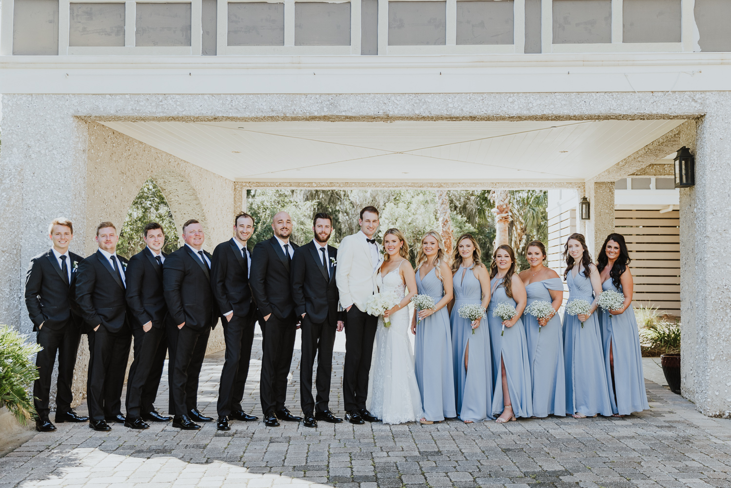 wedding party standing outside of oyster bay yacht club 