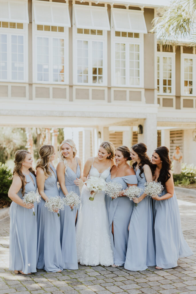 bride with her bridesmaids before wedding at oyster bay in amelia island