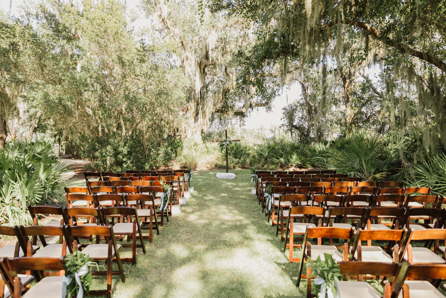 wedding ceremony set up on the lawn of the oyster bay yacht club 