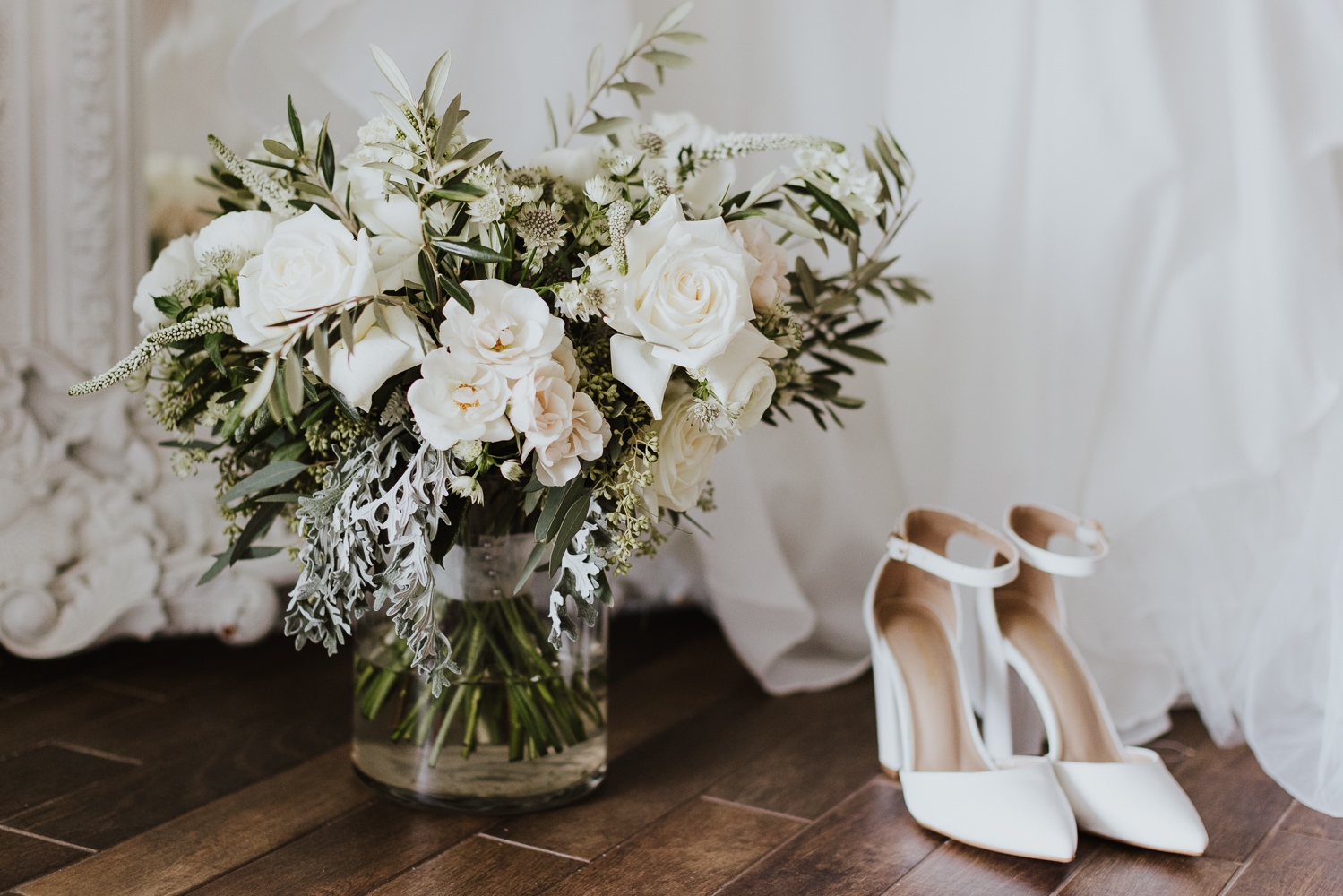 bridal bouquet and white wedding shoes 