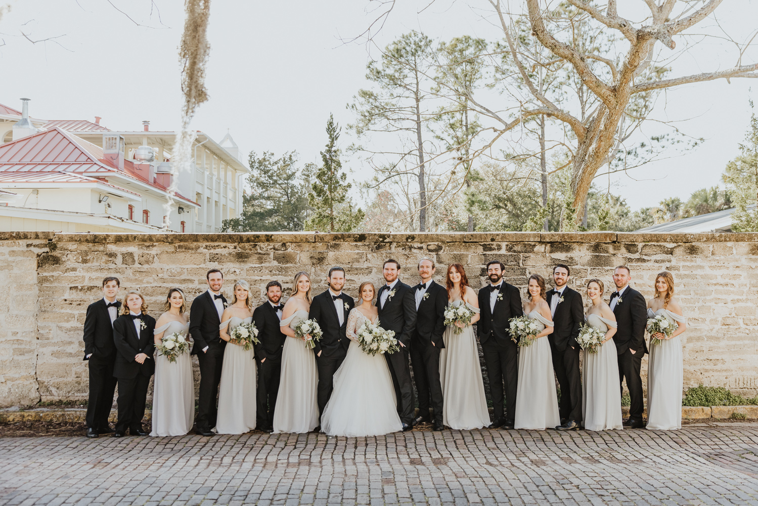 full wedding party lined up on st. augustine street