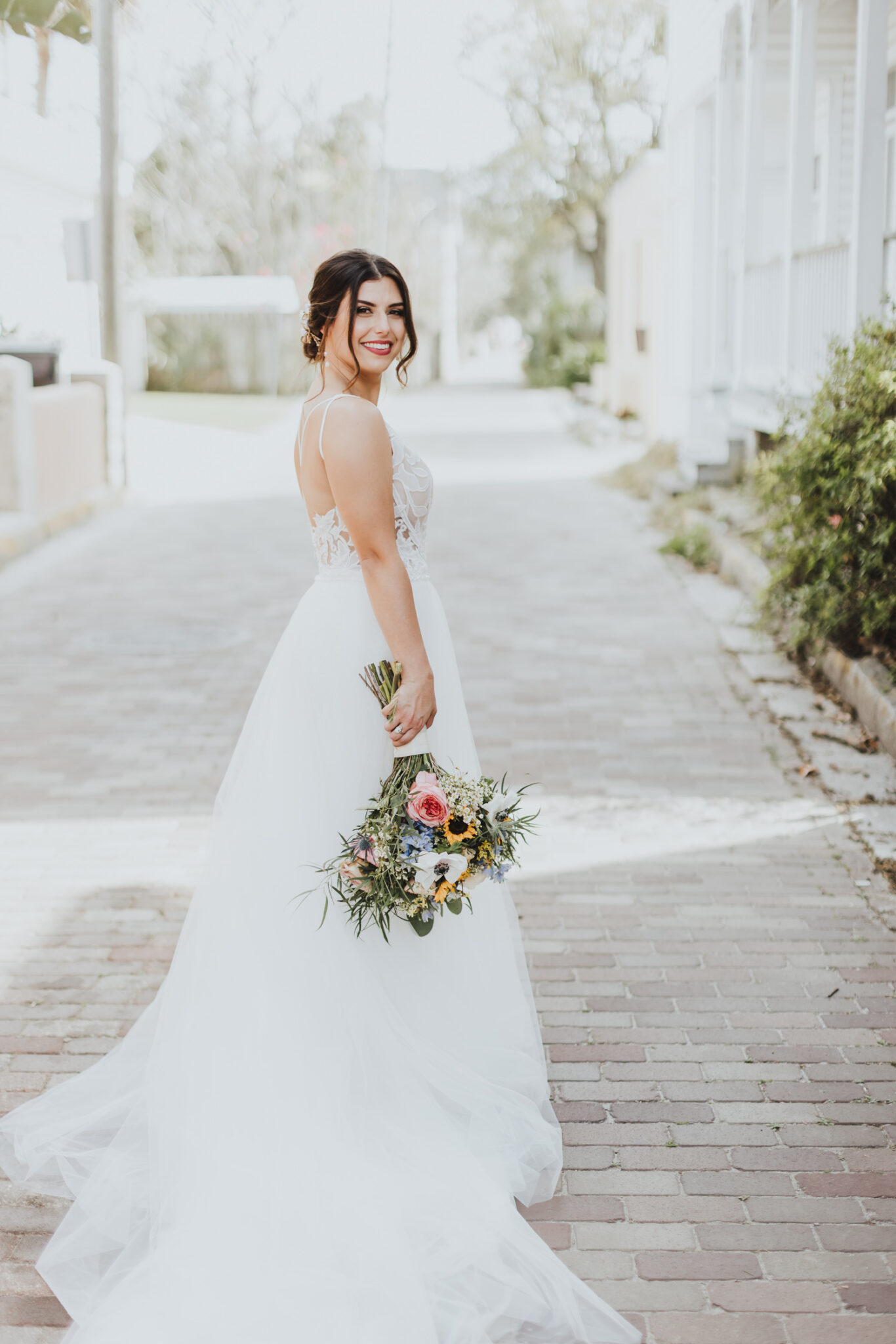 bride turned and looking back while in middle of st. augustine street