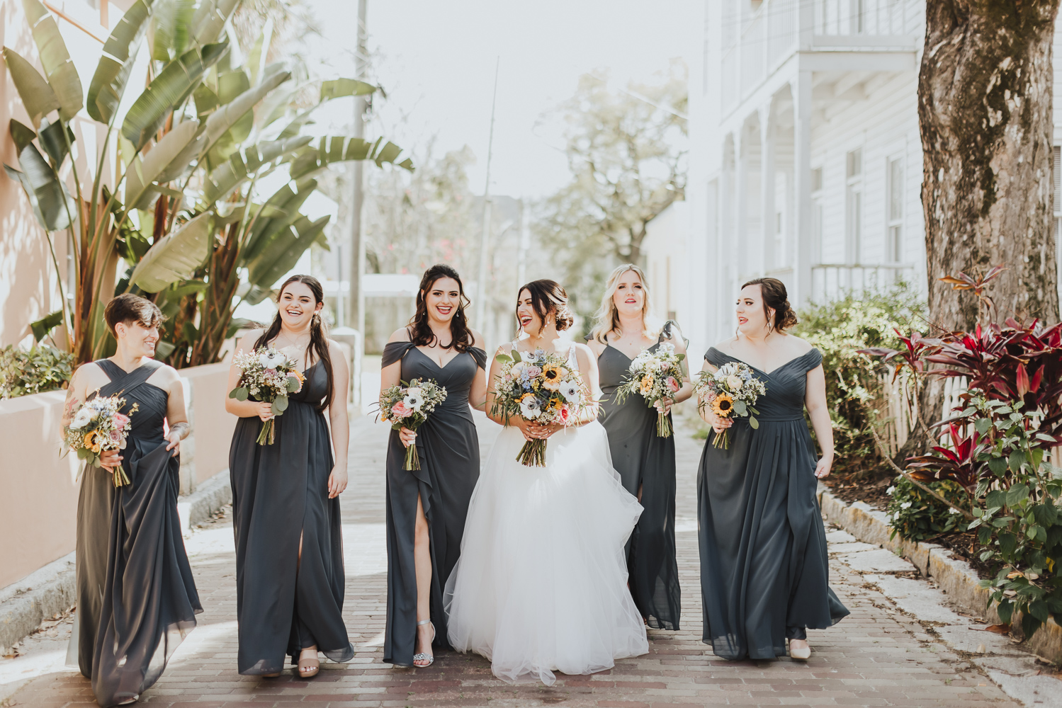 bride walking with her bridesmaids along st. augustine streets