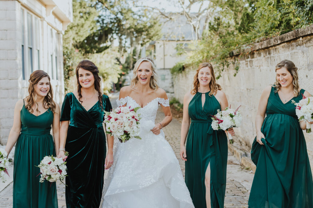 bride and bridesmaids walking along st. augustine streets