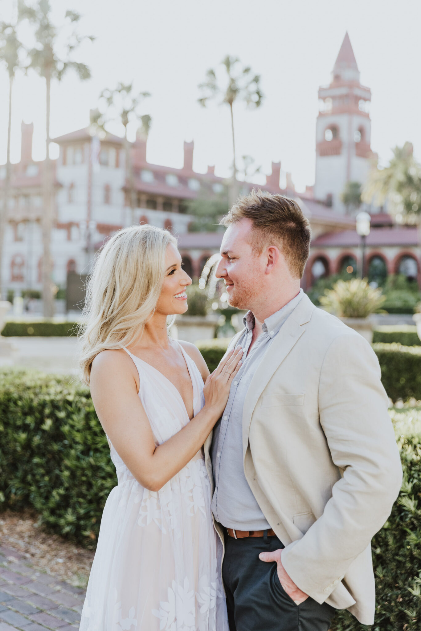 couple looking at each other during engagement photos in st. augustine
