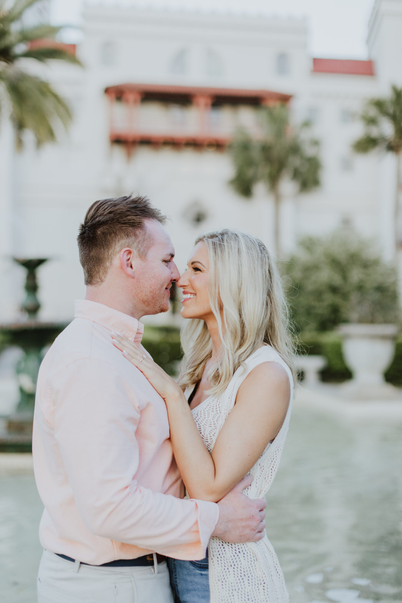 couple looking at each other during engagement session in downtown st. augustine