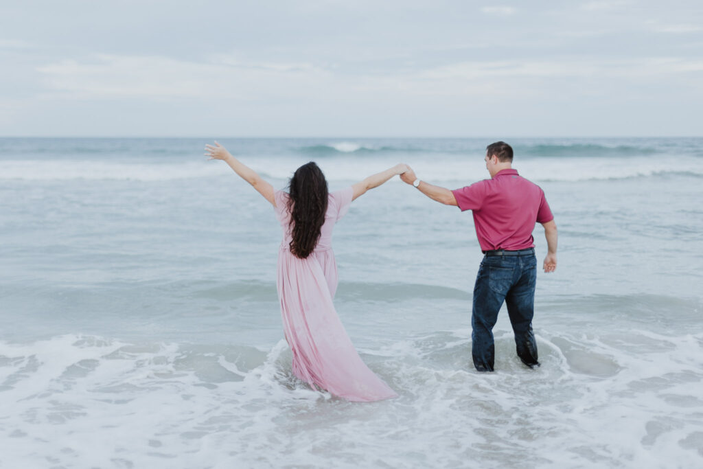 couple excited for their soon to be baby during their maternity session 