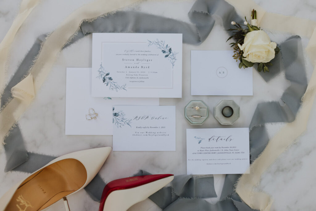 wedding invitations lay flat with wedding details 