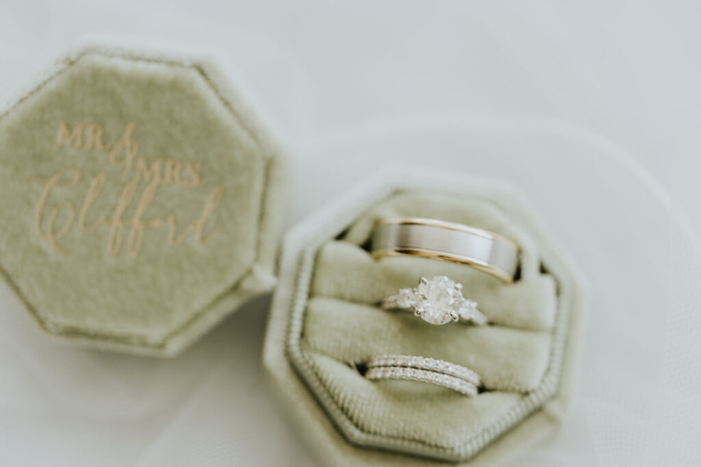 wedding bands in light green ring box