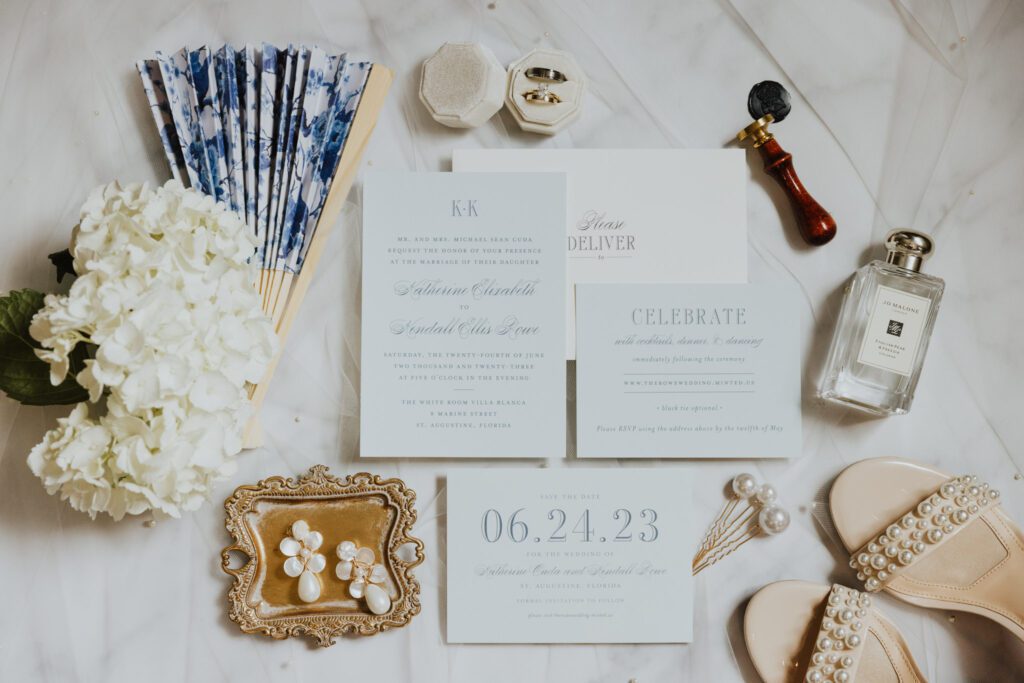 light blue and white wedding invitation suite with bridal details