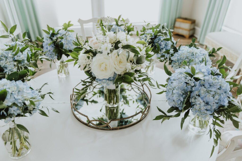 white and light blue bridal bouquet and light blue hydrangeas bridesmaids bouquet 