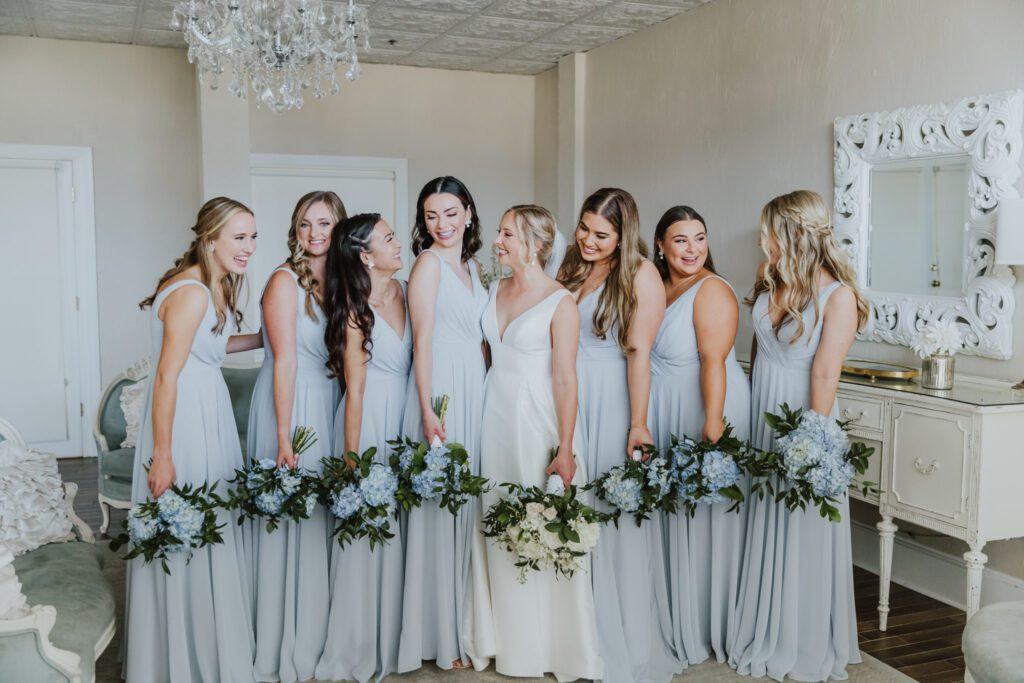 bride with bridesmaids in the bridal suite of the white room in st. augustine