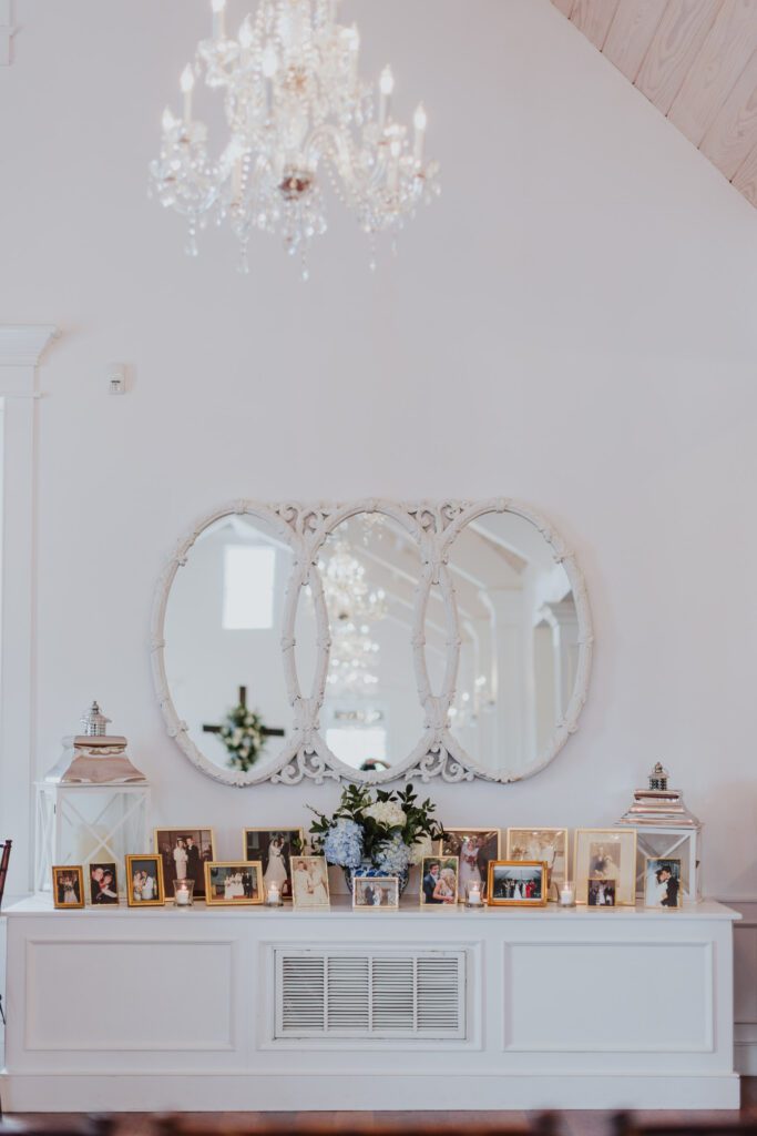 family photographs decorating the white room villa blanca 
