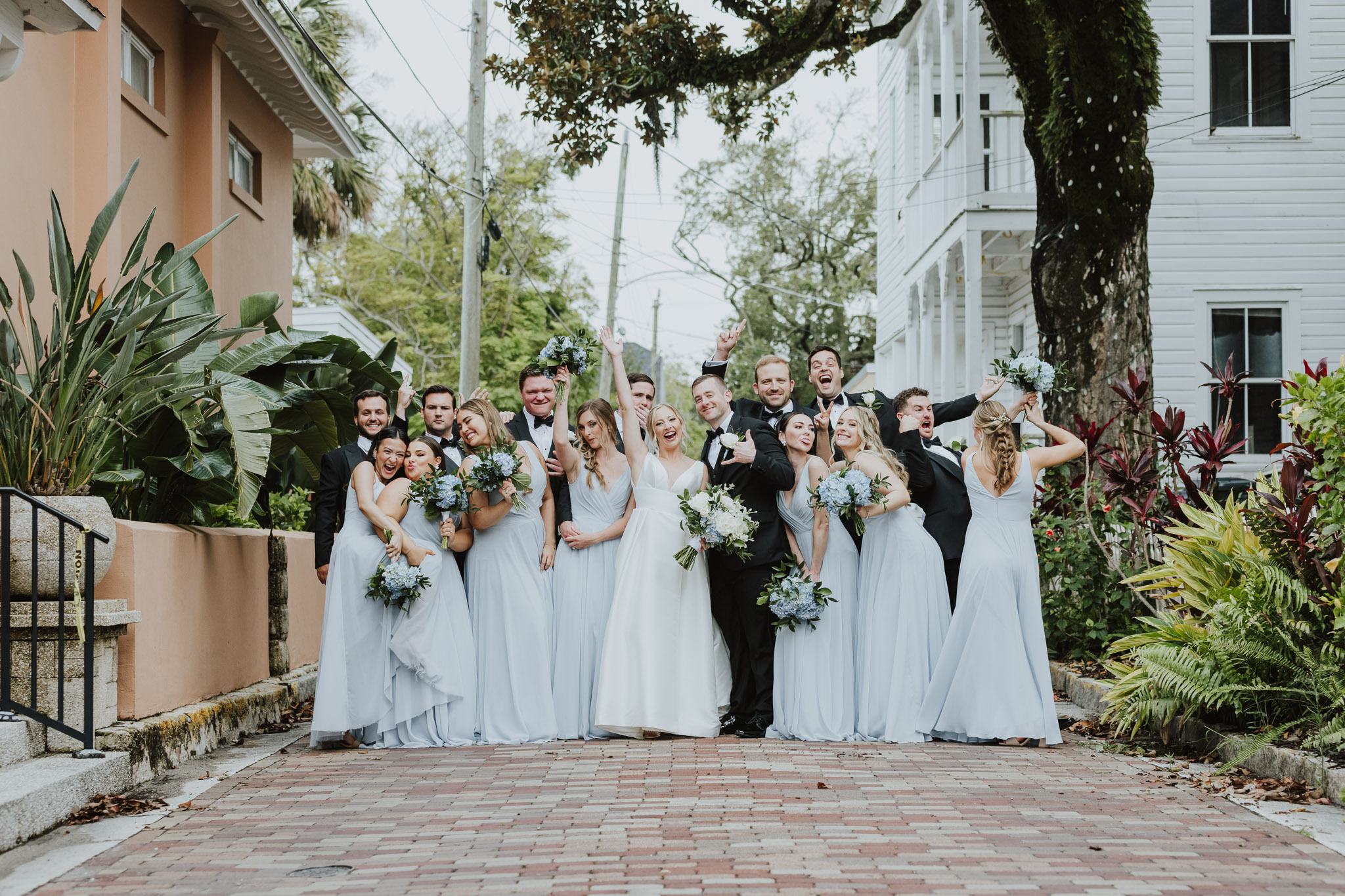 wedding party making faces lined up in st. augustine street