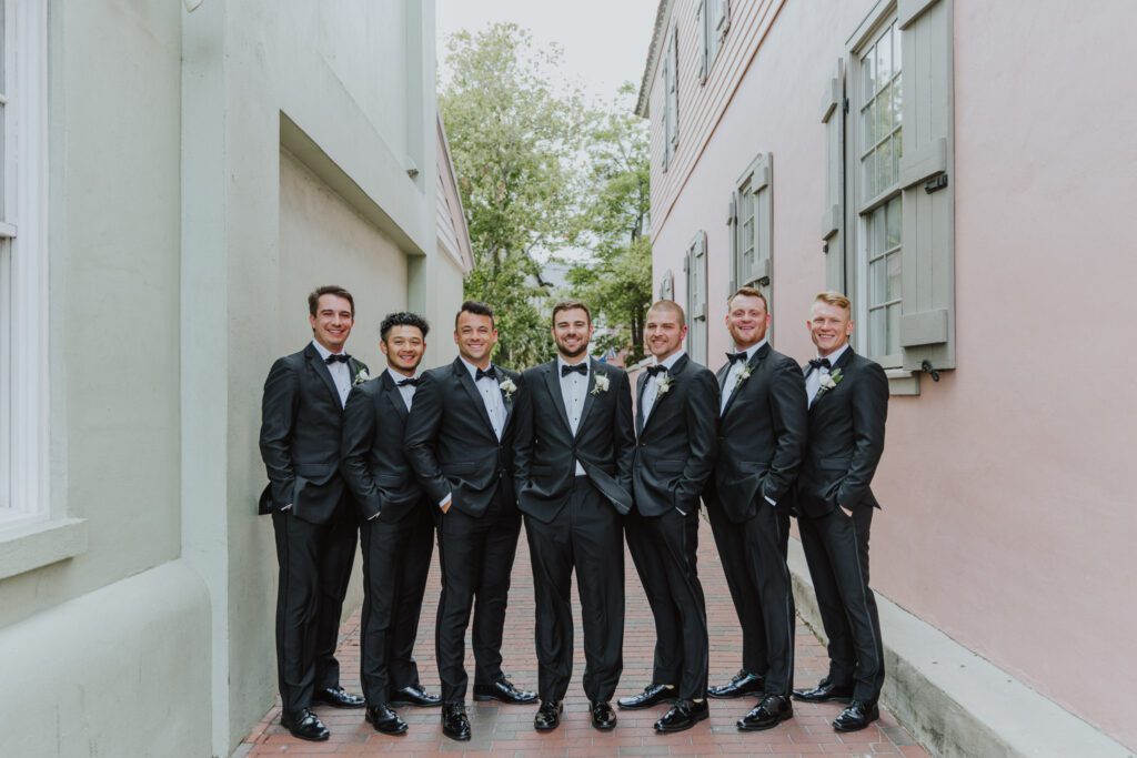 groom and groomsmen lined up in downtown st. augustine